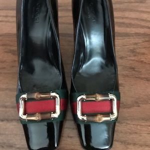 Sale fell through.  Gucci black patent leather pumps.